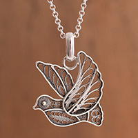 Sterling silver filigree pendant necklace, 'Dark Peace and Grace' - Oxidized Sterling Silver Filigree Dove Necklace from Peru