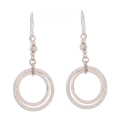 Sterling silver dangle earrings, 'Outer Rings' - Ring-Shaped Sterling Silver Dangle Earrings from Peru