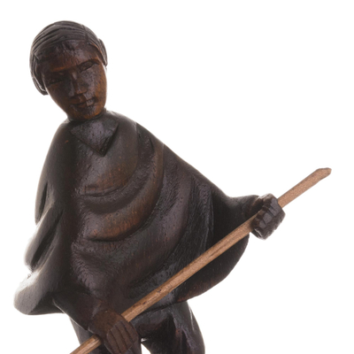 Mahagoni-Holzskulptur, „Caballito de Totora“ – handgeschnitzte Mahagoni-Skulptur eines Mannes auf einem Schilfboot