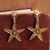 Gold plated sterling silver filigree dangle earrings, 'Starry Cosmos' - Gold Plated Sterling Silver Filigree Star Earrings from Peru thumbail