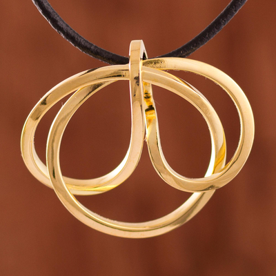 Gold plated copper pendant necklace, 'Amazon Knot' - Knot-Shaped Gold Plated Copper Pendant Necklace from Peru