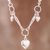 Sterling silver pendant necklace, 'Rain of Hearts' - Heart Motif Sterling Silver Pendant Necklace from Peru thumbail