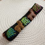 Wool headband, 'Llama Parade' - Embroidered Llama Pattern Wool Headband from Peru