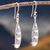 Sterling silver dangle earrings, 'Candida Flower' - Floral-Inspired Sterling Silver Dangle Earrings from Peru