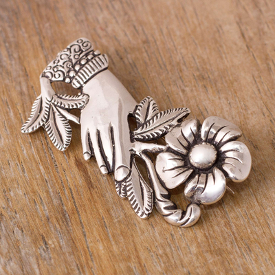 Silver brooch, 'Natural Universe' - Peruvian Silver Brooch of a Hand Clutching a Flower
