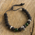 Lava stone and onyx beaded bracelet, 'Skull in the Night' - Lava Stone and Green Onyx Beaded Silver Skull Bracelet thumbail