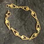 Gold-plated filigree link bracelet, 'Spiral Teardrops' - Gold-Plated Sterling Silver Filigree Link Bracelet