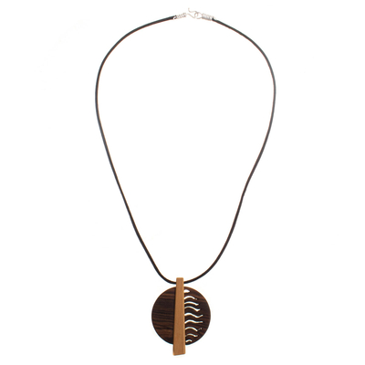 Wood pendant necklace, 'Rescued Spirit' - Guayacan and Aguano Masha Wood pendant on Nylon Cord