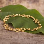 Gold plated filigree link bracelet, 'Beaded Infinity' - 21K Gold Plated Silver Chain Bracelet with Infinity Symbols