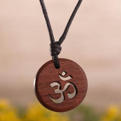 Wood pendant necklace, 'Peruvian Omkara' - Sacred Om Symbol on Tropical Wood with Black Cotton Cord