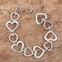 Sterling silver link bracelet, 'Heart After Heart' - Heart-shaped Sterling Silver Link Bracelet Crafted in Peru
