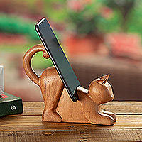 Wood phone holder, 'Convenient Purr' - Hand-Carved Cedar Wood Cat Phone Holder from Peru