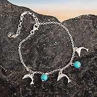 Sterling silver charm bracelet, 'Marine Protection' - Dolphin-Themed Reconstituted Turquoise Charm Bracelet