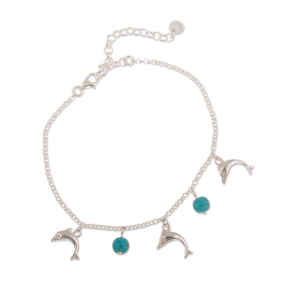 Sterling silver charm bracelet, 'Marine Protection' - Dolphin-Themed Reconstituted Turquoise Charm Bracelet