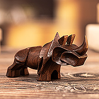 Cedarwood figurine, 'Loner of the Plain' - Modern Minimalist Rhino Figurine Carved by Hand in Cedarwood