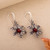 Carnelian dangle earrings, 'Valiant Hibiscus' - Oxidized and Polished Carnelian Hibiscus Dangle Earrings