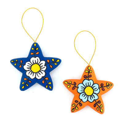 Ceramic ornaments, 'Ayacucho Flowered Stars' (pair) - 2 Orange Blue Star Floral-Themed Ceramic Christmas Ornaments