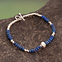 Lapis lazuli beaded pendant bracelet, 'Stellar Journey' - Lapis Lazuli Beaded Bracelet with Silver Accents and Pendant