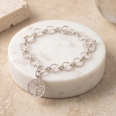 Sterling silver charm bracelet, 'Roots at Dawn' - Tree of Life-Themed Sterling Silver Charm Link Bracelet