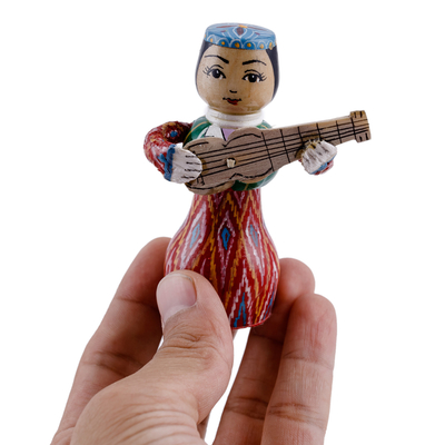 Wood figurine, 'Tanbur Red Rhythms' - Painted Traditional Red Wood Figurine of Girl and Tanbur