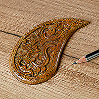 Wood magnet, 'The Paisley Eden' - Hand-Carved Paisley-Shaped Floral Walnut Wood Magnet