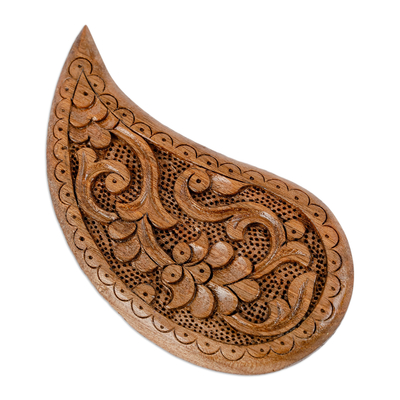 Wood magnet, 'The Paisley Eden' - Hand-Carved Paisley-Shaped Floral Walnut Wood Magnet