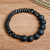 Hematite and vulcanite beaded stretch bracelet, 'Night Worlds' - Black Hematite and Vulcanite Beaded Stretch Bracelet