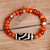 Carnelian and agate beaded stretch pendant bracelet, 'Orange Fate' - Carnelian and Agate Beaded Dzi Pendant Bracelet in Orange