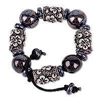 Ceramic beaded stretch bracelet, 'Luxurious Season' - Floral Black Ceramic Beaded Stretch Bracelet from Uzbekistan