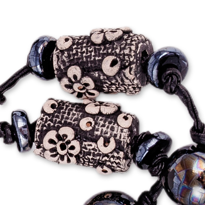 Ceramic station necklace, 'Luxurious Season' - Floral Black Ceramic Station Necklace from Uzbekistan