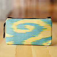 Cotton cosmetic bag, 'Tropical Feel' - Spiral Yellow Ikat Patterned Cotton Cosmetic Bag with Zipper