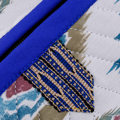 Ikat cotton cosmetic bag, 'Hypnotic Patterns' - Handmade Uzbek Ikat Cotton Cosmetic Bag with Handle