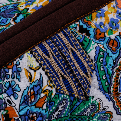 Ikat cotton cosmetic bag, 'Gorgeous Garden' - Handcrafted Floral Ikat Cotton Cosmetic Bag with Handle