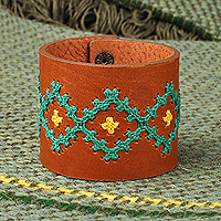 Leather wristband bracelet, 'Marash Radiant Waves' - Leather Wristband Bracelet with Turquoise Cross-Stitch Motif