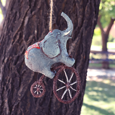 Papier mache ornament, 'Giant's Spectacle' - Hand-Painted Papier Mache Ornament of Elephant on a Bike