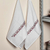 Cotton tea towels, 'Burgundy Saga' (pair) - Arrow-Themed Burgundy and Beige Cotton Tea Towels (Pair)