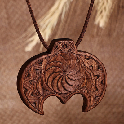 Wood pendant necklace, 'Wisdom Talisman' - Hand-Carved Traditional Walnut Wood Pendant Necklace