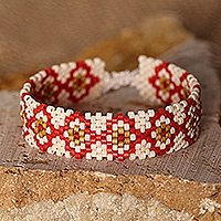 Glass beaded wristband bracelet, 'Spring Desire' - Folk Art Spring-Themed Red Glass Beaded Wristband Bracelet