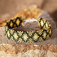 Glass beaded wristband bracelet, 'Green Damsel' - Armenian-Patterned Green Glass Beaded Wristband Bracelet