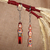 Wood keychains, 'Romantic Taraz' (set of 2) - 2-Piece Red and Beige Taraz Couple Beechwood Keychain Set