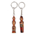 Wood keychains, 'Romantic Taraz' (set of 2) - 2-Piece Red and Beige Taraz Couple Beechwood Keychain Set