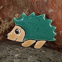 Ceramic brooch pin, 'Hedgehog Days' - Glazed Hedgehog-Shaped Green and Brown Ceramic Brooch Pin