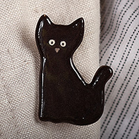 Ceramic brooch pin, 'Mysterious Feline' - Handcrafted Black Cat-Themed Ceramic Brooch Pin from Armenia