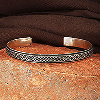 Sterling silver cuff bracelet, 'Tie to Magnificence' - Traditional Oxidized Folk Art Sterling Silver Cuff Bracelet