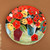 Ceramic decorative plate, 'Tulip Bloom' - Tulip-Themed Painted Red and Green Ceramic Decorative Plate
