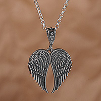 Sterling silver pendant necklace, 'Wings of Serenity' - Handmade Oxidized Necklace with Sterling Silver Wing Pendant