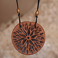 Ceramic pendant necklace, 'Radiant Universe' - Star-Themed Ceramic Pendant Necklace in Black and Brown Hues