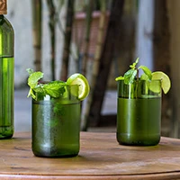 Upcycled tumbler glasses, 'Tall Dafu Green' (pair) - Pair of Upcycled African Wine Bottle Tumbler Glasses
