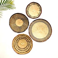 Natural fiber basket wall art, 'Tonga Baskets' (set of 4) - Set of 4 Handwoven Natural Fiber Basket Wall Art from Africa