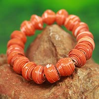 Recycled paper stretch bracelet, 'Taifa Tangerine' - Orange Handmade Bracelet with Recycled Paper Beads